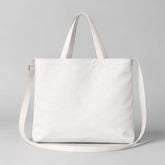 Stockka white canvas messenger bag with dual straps, perfect for everyday use or custom branding.