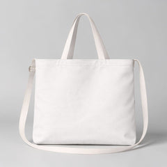 Stockka white canvas messenger bag with dual straps, perfect for everyday use or custom branding.