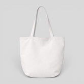 Stockka white canvas tote bag with long shoulder straps, perfect for everyday use or branding.