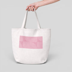 Stockka white canvas tote bag with long handles and a pink geometric pattern. Ideal for everyday use or branding.