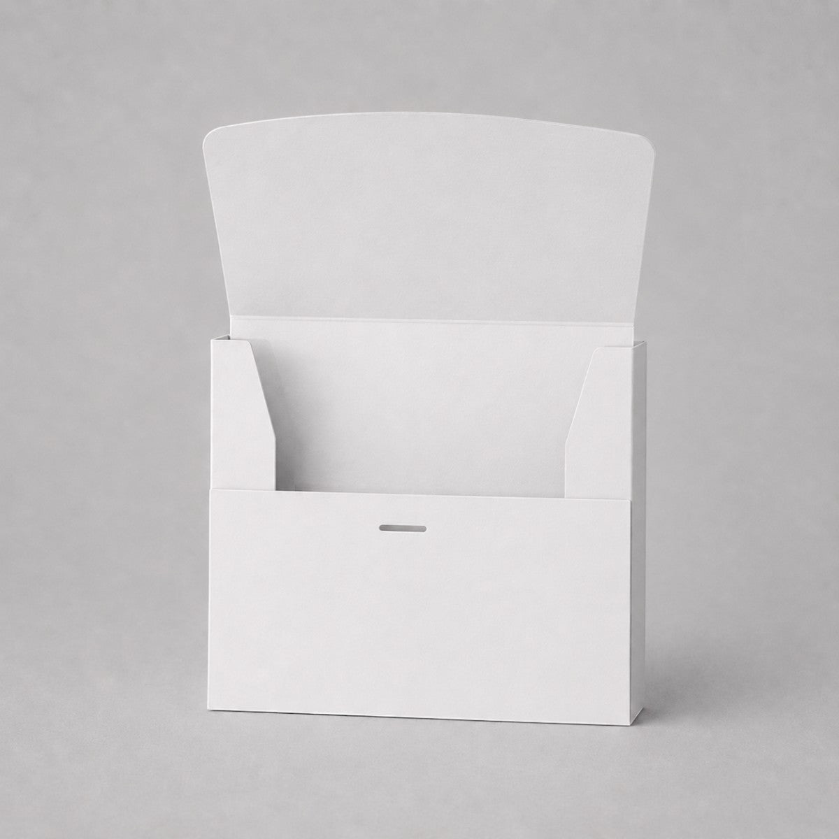 Stockka white matte coated cardboard box with front opening and internal tabs for secure closure. Ideal for marketing kits or small product sets.