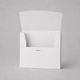 Stockka white matte coated cardboard box with front opening and internal tabs for secure closure. Ideal for marketing kits or small product sets.