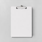 Stockka white corrugated cardboard clipboard with a silver metal clip, perfect for events and conferences.