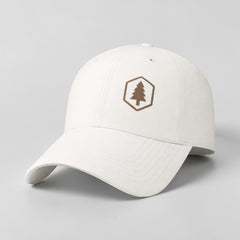 Stockka white cotton twill baseball cap with adjustable plastic closure and embroidered tree logo.