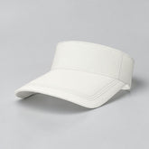 Stockka white cotton tennis visor with adjustable strap and curved brim for sun protection.