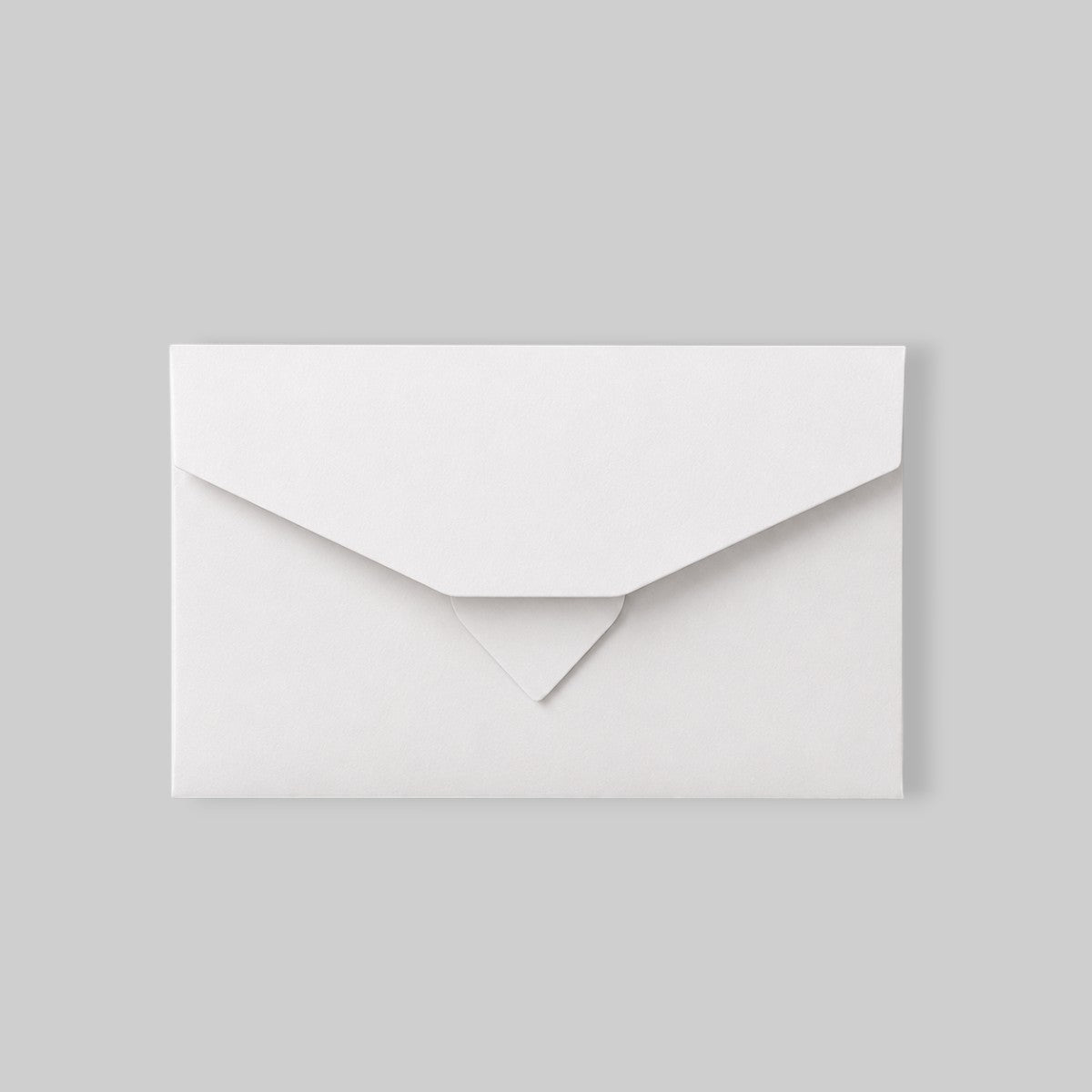 Stockka elegant white flat envelope with a triple closure, made of matte coated chromo paper.