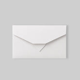 Stockka elegant white flat envelope with a triple closure, made of matte coated chromo paper.