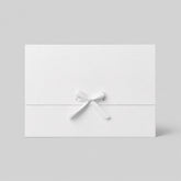 Stockka white paper gift envelope with satin ribbon tie closure, perfect for gift vouchers or greeting cards.