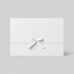 Stockka white paper gift envelope with satin ribbon tie closure, perfect for gift vouchers or greeting cards.