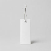 Stockka white rectangular hang tag with reinforced eyelet and string, ideal for retail.