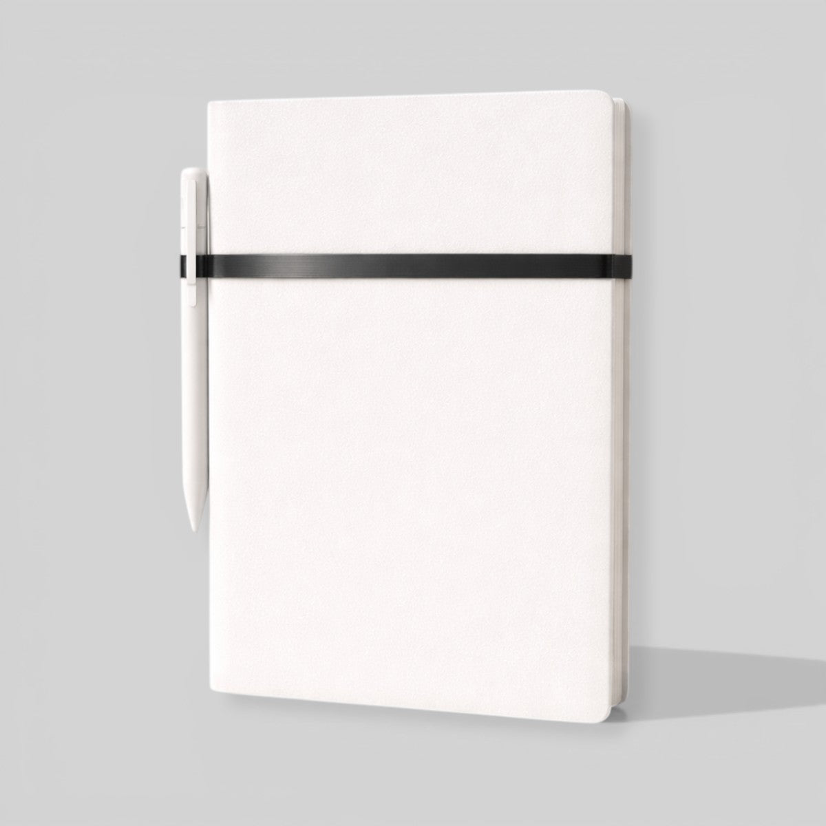 Stockka white hardcover notebook with pen holder and black elastic closure, 80 lined pages.