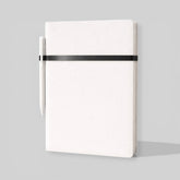 Stockka white hardcover notebook with pen holder and black elastic closure, 80 lined pages.