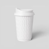 Stockka medium white corrugated kraft paper cup with black lid, ideal for coffee or tea.