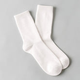 Stockka white mid-calf socks made of cotton and spandex, offering comfort and breathability for casual wear.
