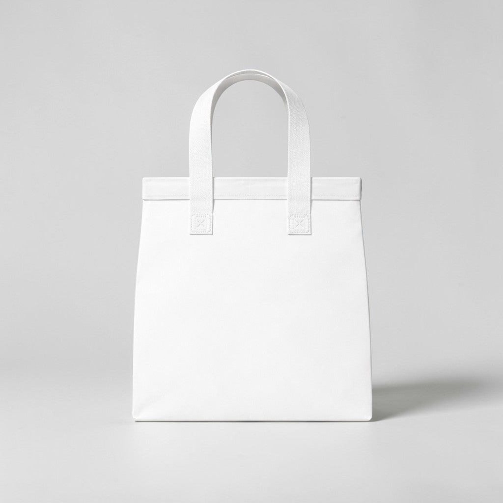 Stockka medium white non-woven polypropylene tote bag with strong handles, ideal for retail and food service.