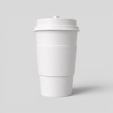 Stockka 473ml double-walled white paper coffee cup with insulating sleeve and black lid.