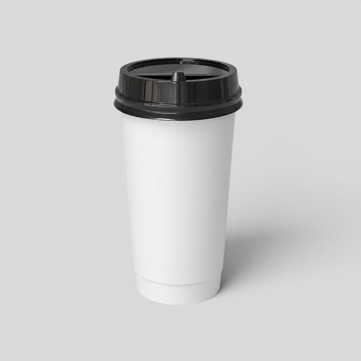 Stockka white paper coffee cup with black lid, ideal for takeaway hot drinks like coffee or tea.