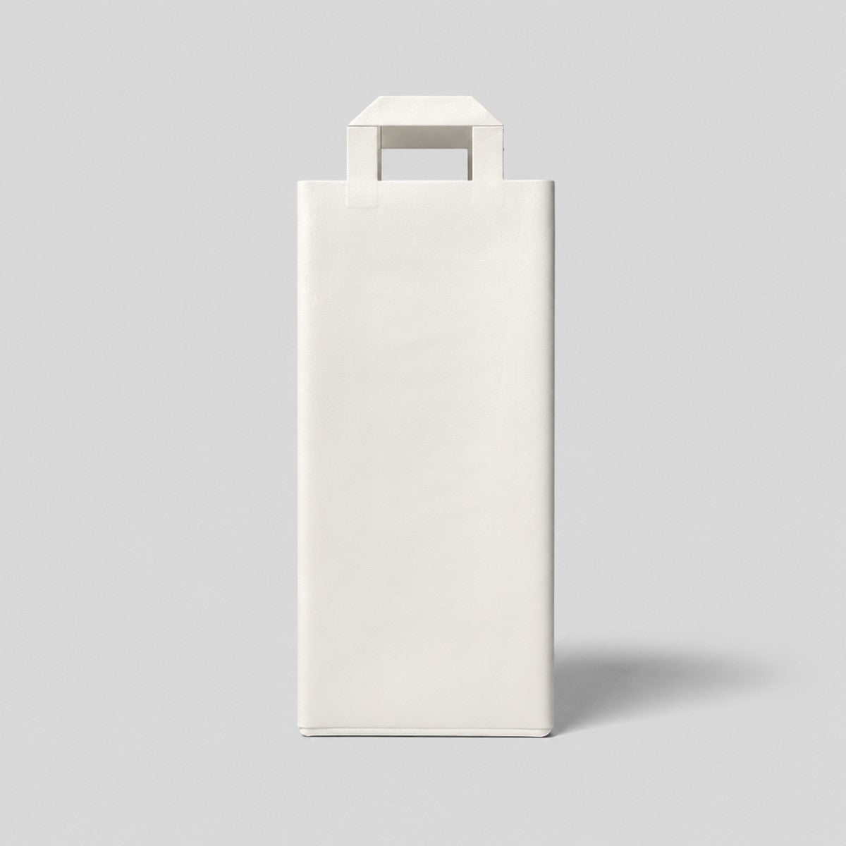 Stockka white paper wine bottle gift bag with reinforced base and carrying handles, ideal for gifts and branding.