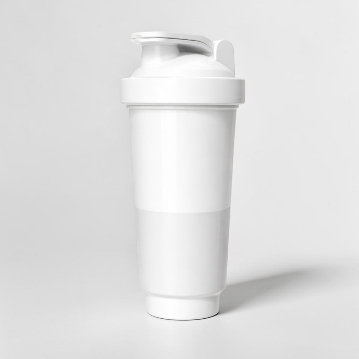 Stockka white BPA-free plastic shaker bottle with patented lid, ideal for protein shakes and cold drinks.