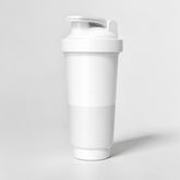 Stockka white BPA-free plastic shaker bottle with patented lid, ideal for protein shakes and cold drinks.