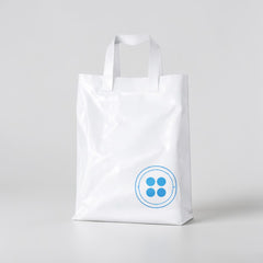 Stockka white plastic shopping bag 30x40cm with soft loop handles and blue button logo