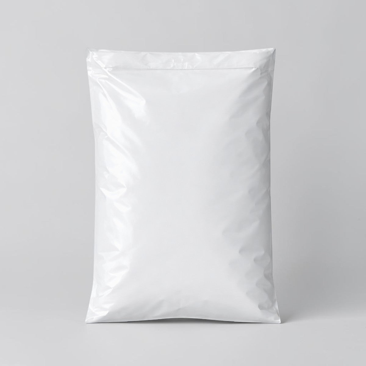 Stockka white vertical poly mailer bag with self-adhesive strip, made of durable LDPE plastic for shipping online orders.