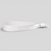 Stockka white polyester wristband with adjustable plastic closure, ideal for events and festivals.