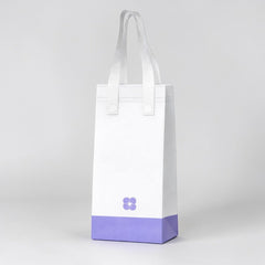 Stockka white non-woven tote bag with a purple base and a small purple flower logo, ideal for carrying cups.