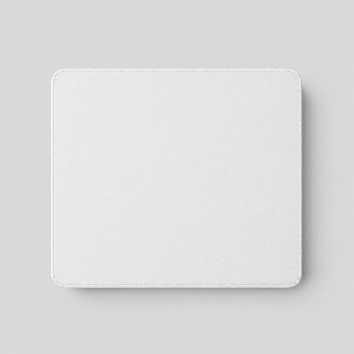 Stockka classic rectangular white mousepad with rounded corners, ideal for smooth mouse movement during work or gaming.