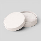 Stockka white round jewelry box with removable lid, made of matte finish rigid cardboard, ideal for rings, earrings, or accessories.