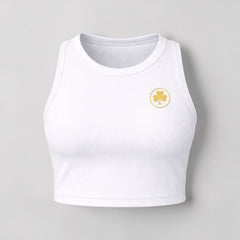 Stockka white cotton-spandex blend crop top with a gold shamrock logo on the chest. Sleeveless, fitted design.