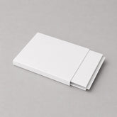 Stockka white matte cardboard slider box packaging, ideal for gift vouchers, luxury tickets, or premium promotional items.