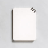 Stockka white spiral notebook with 80 lined pages and soft cover, ideal for custom designs.