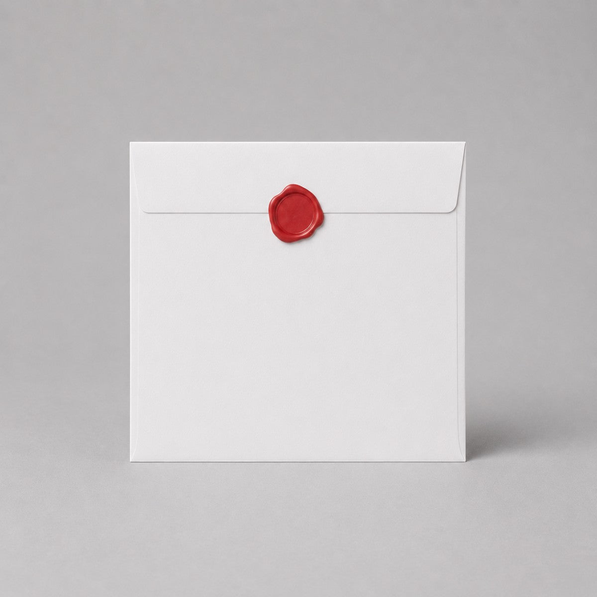 Stockka white square envelope with red wax seal closure, made of high-quality white wood-free paper.