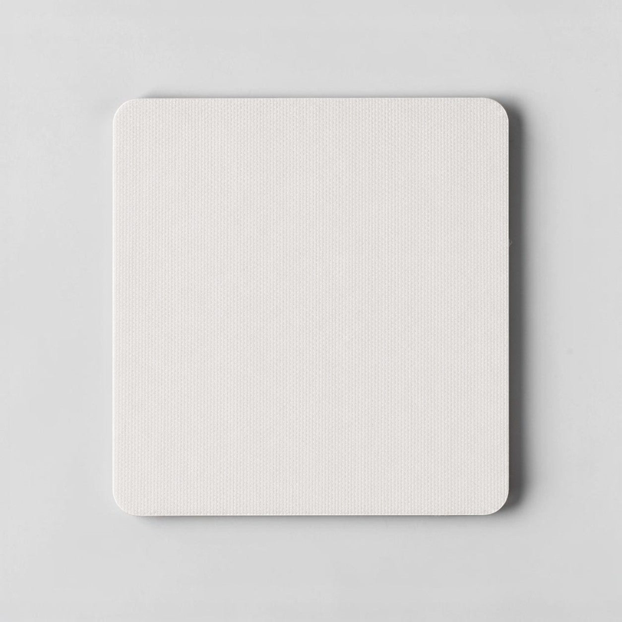 Stockk, white square mousepad with rounded corners and textured surface, modern design for a clean desk.