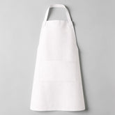 Stockka white full-length apron with vertical stripes, adjustable neck strap, and large front pocket. Cotton-polyester blend.