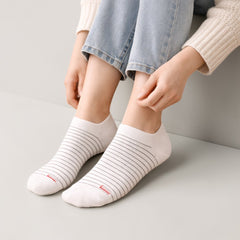 Stockka white cotton blend ankle socks with thin grey stripes and a small red accent detail.