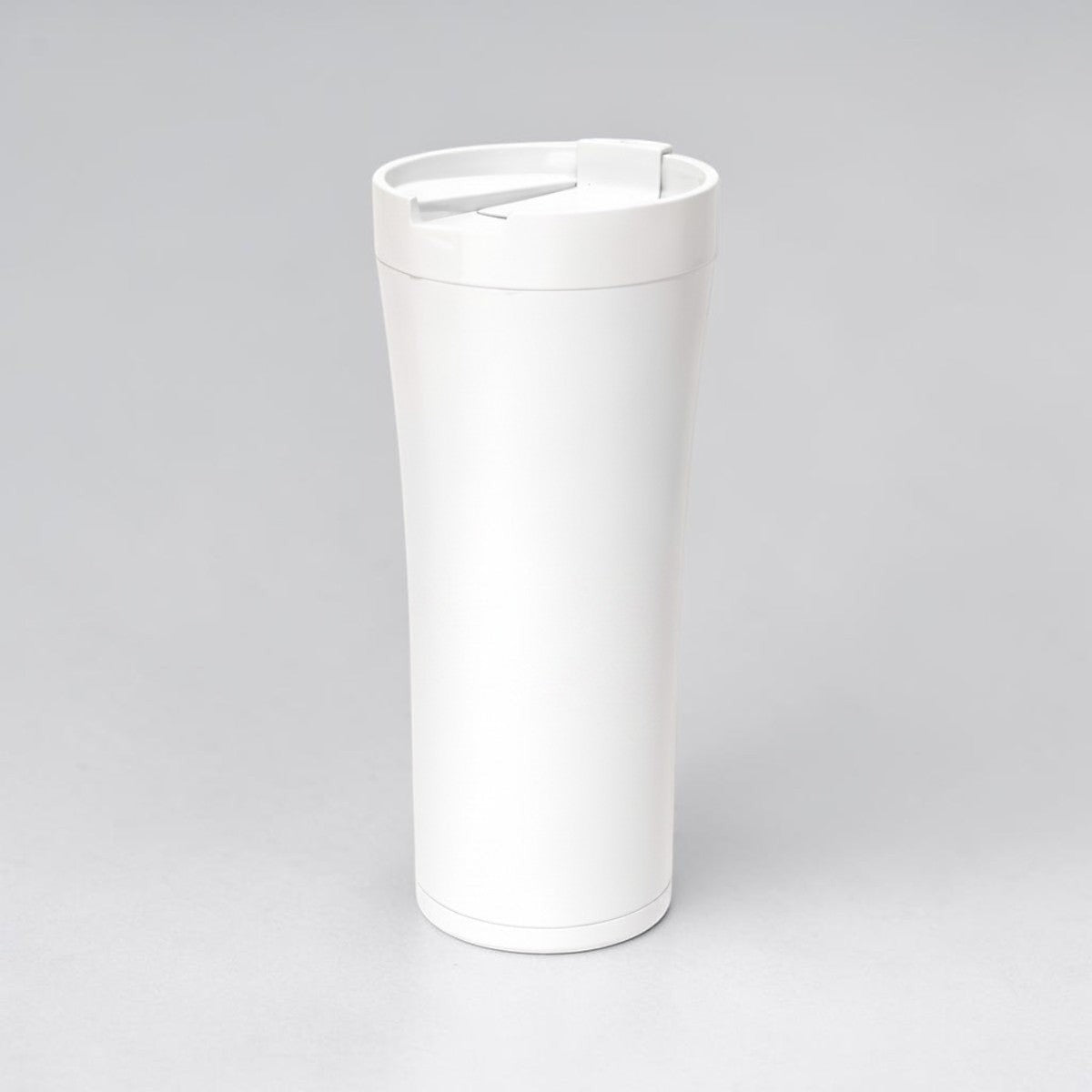 Stockka tall white double-walled stainless steel thermal tumbler with a secure lid and drinking opening.