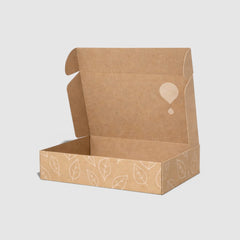 Stockka wide folding mailer box made of recycled cardboard with leaf pattern and logo detail.