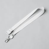 Stockka wide white nylon lanyard with side buckle and two metal clips for ID badges or accessories.