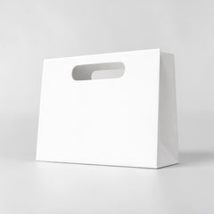 Paper carrier bag with cut-out handle