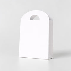 Shopping paper bag with rounded cut handle