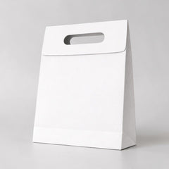 Paper carrier bag with cut-out handle