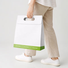 Paper carrier bag with cut-out handle