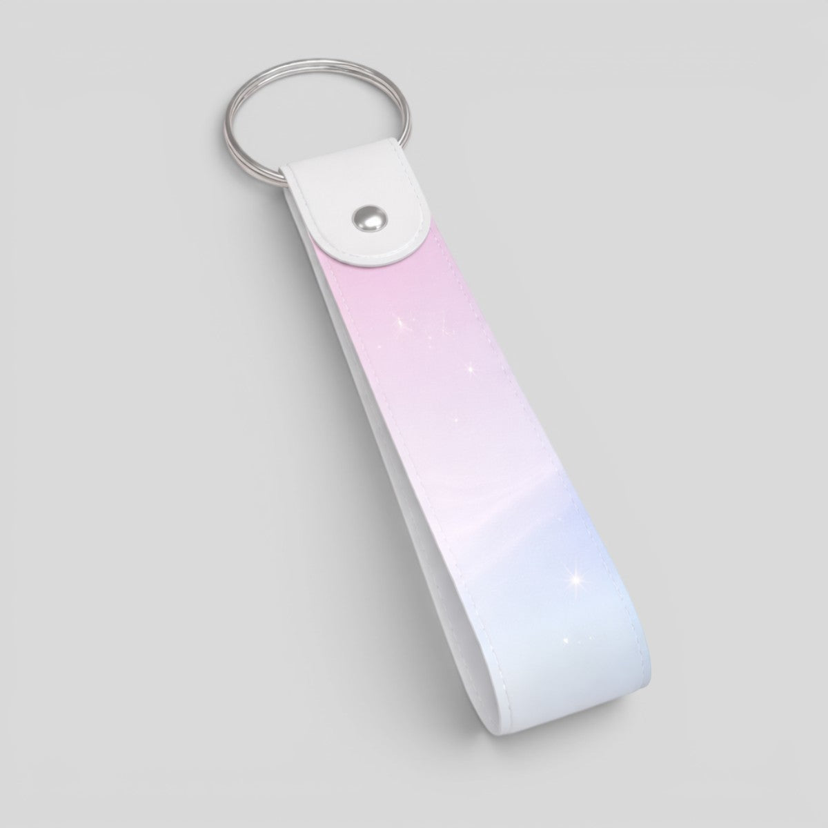 Stockk customisable loop keychain with a pastel pink and blue gradient, made of synthetic leather and metal ring.