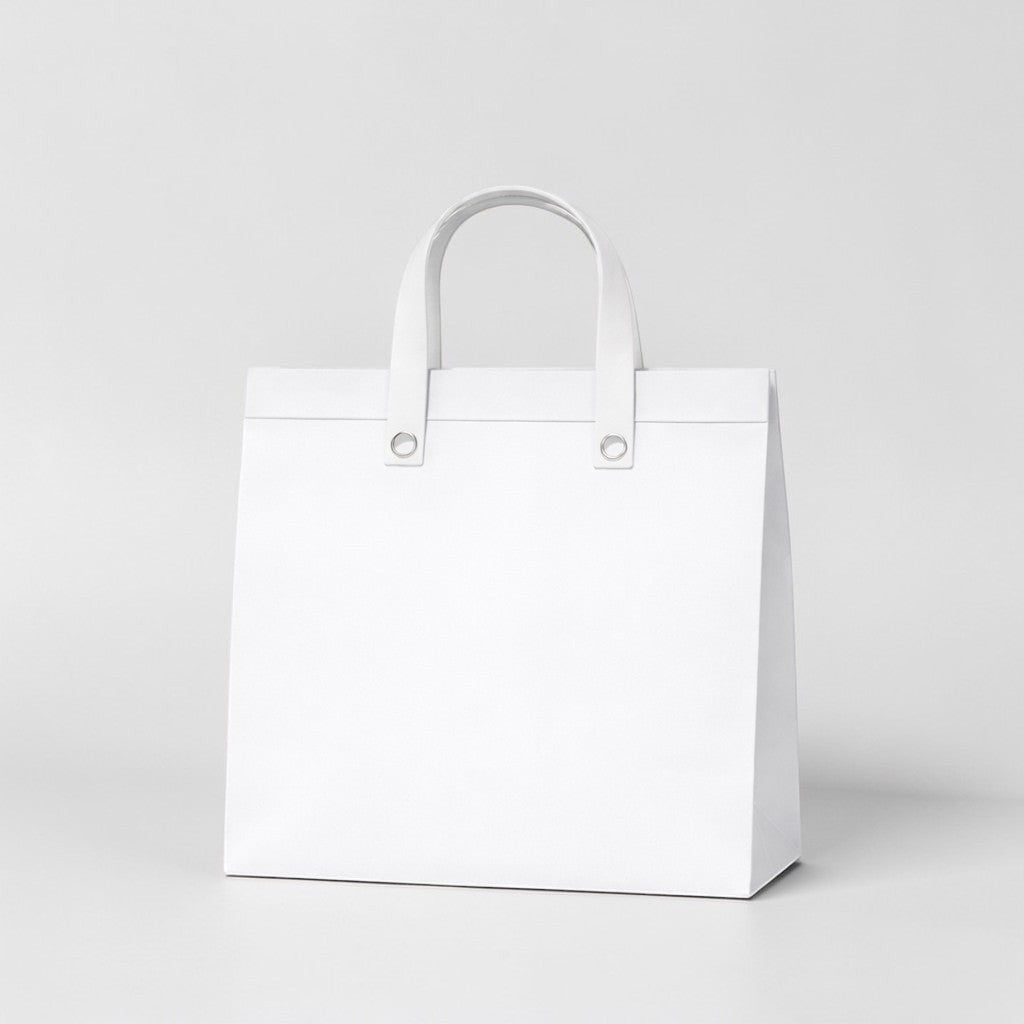 Stockk large white non-woven tote bag with reinforced handles, ideal for premium packaging and gifts.