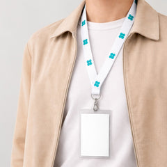 Stockk premium wide lanyard with teal flower pattern, metal clip, and clear badge holder. Made of satin or polyester.