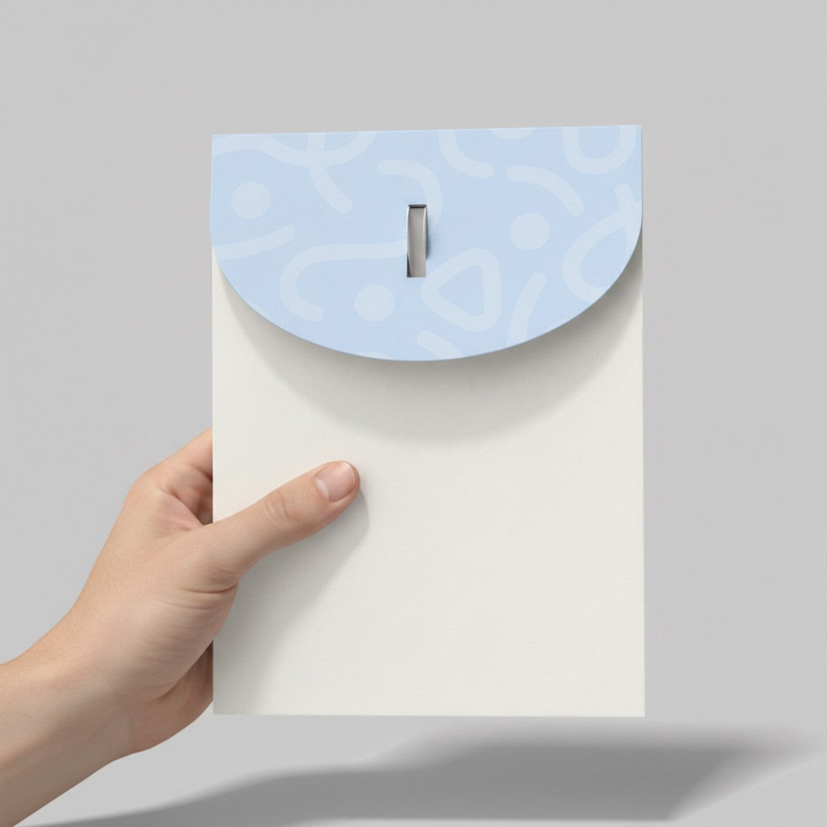 Stockka A4 standing cardboard folder with a round tab and smart slot closure. White with light blue patterned flap.