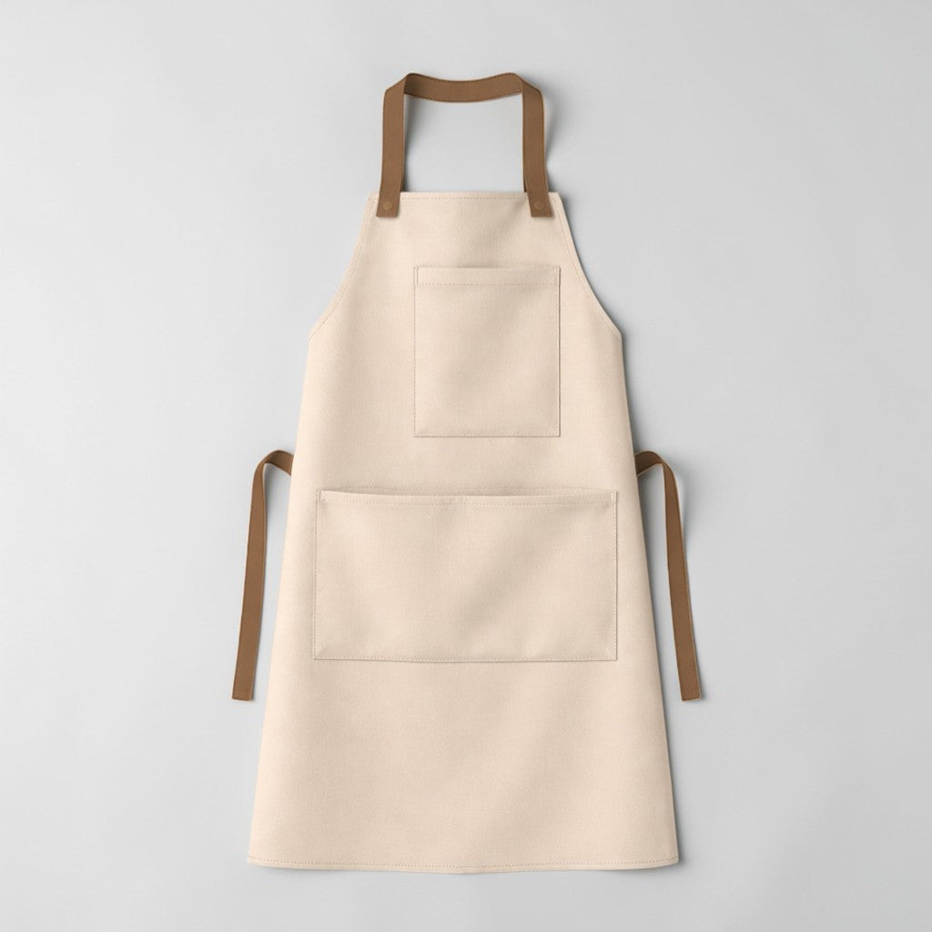 Stockka full-length beige cotton-polyester blend apron with two pockets and brown straps. Ideal for kitchens, workshops, cafes.