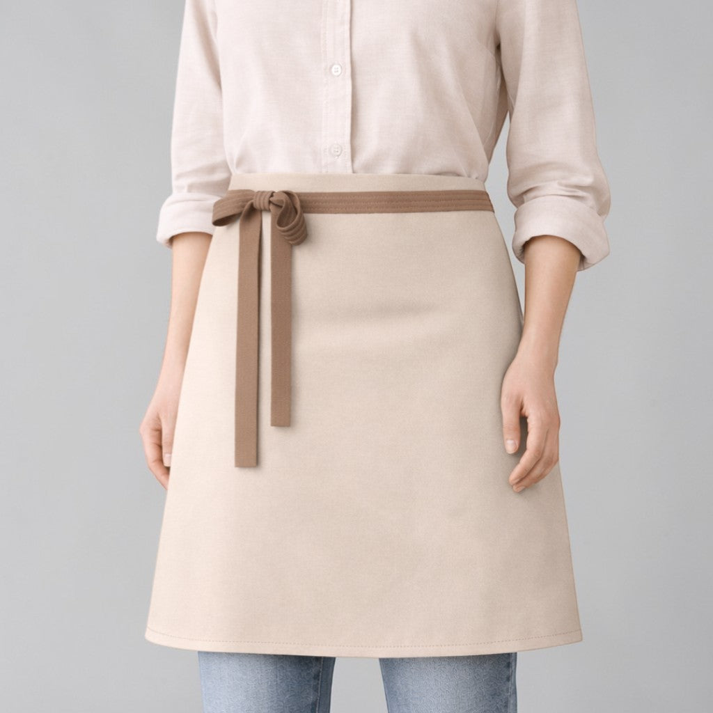 Stockka classic waist apron in beige cotton-polyester blend with brown tie. Ideal for cafes and restaurants.